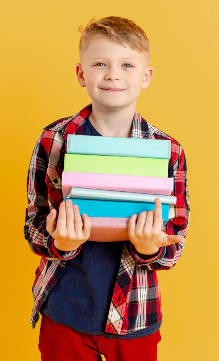 Student excited about learning with colorful books
